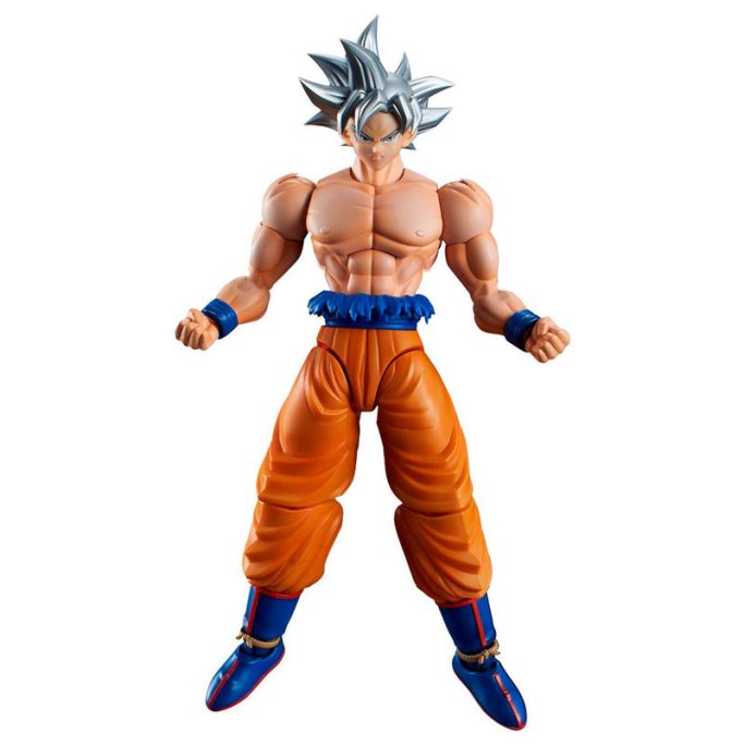 Figurita de un personaje de anime con cabello plateado y ropa naranja y azul.