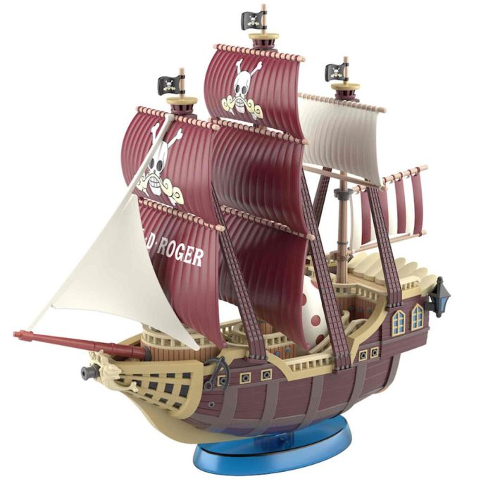 Barco pirata de madera con velas rojas y bandera de calavera.
